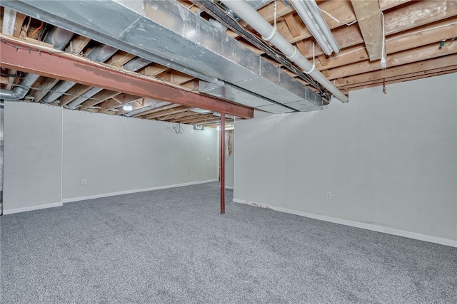 unfinished basement with carpet and baseboards