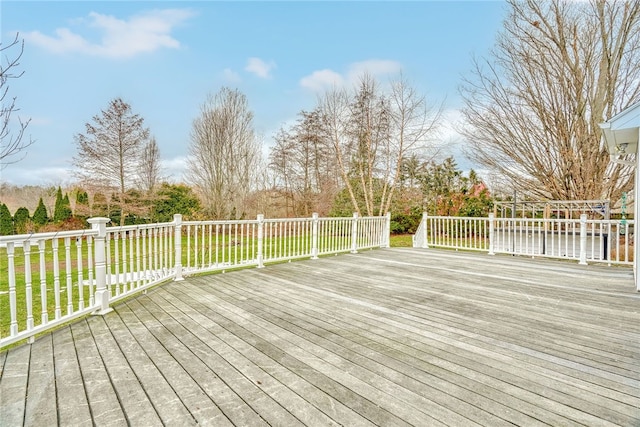 wooden deck with a yard