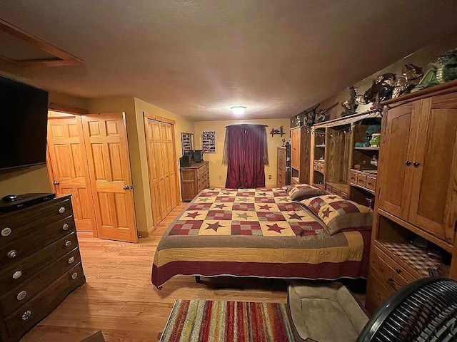 bedroom with light wood-style flooring