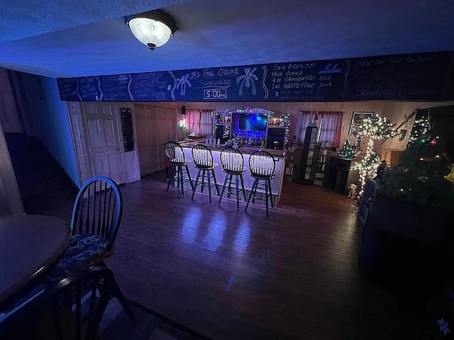 bar featuring a dry bar and wood finished floors