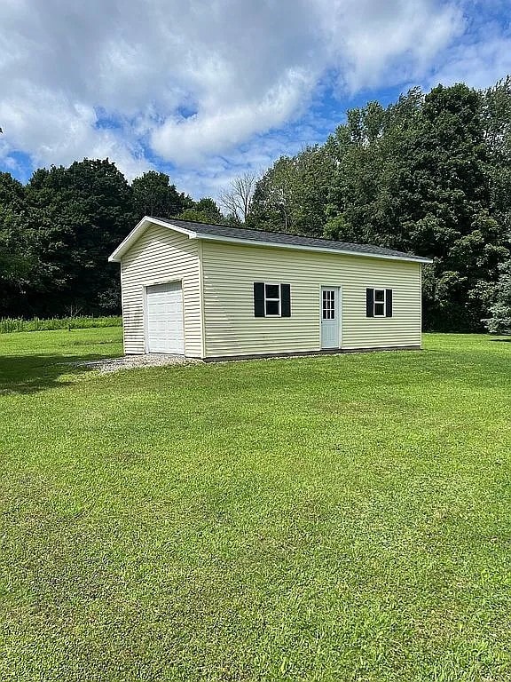 7429 Cherry Street Rd, Sennett, NY 13021 - exterior space with a lawn and an outdoor structure