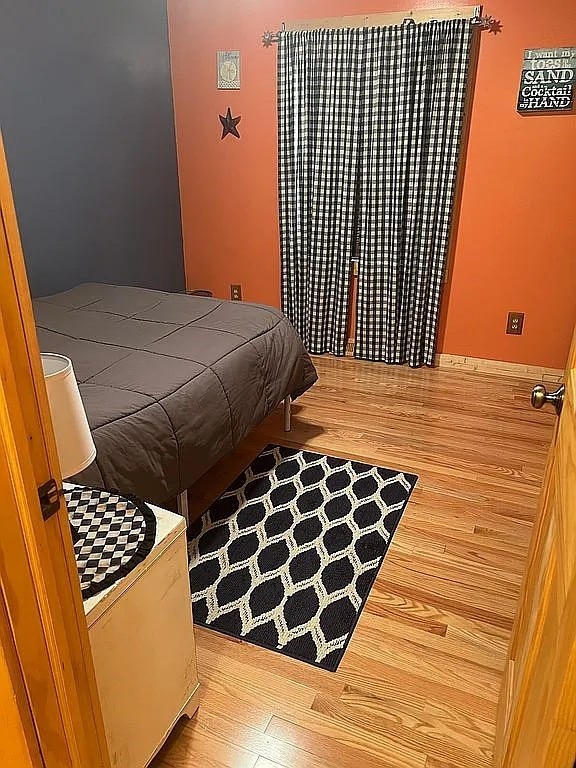 bedroom featuring wood finished floors