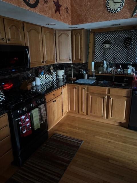 7429 Cherry Street Rd, Sennett, NY 13021 - kitchen featuring tasteful backsplash, black appliances, and a sink