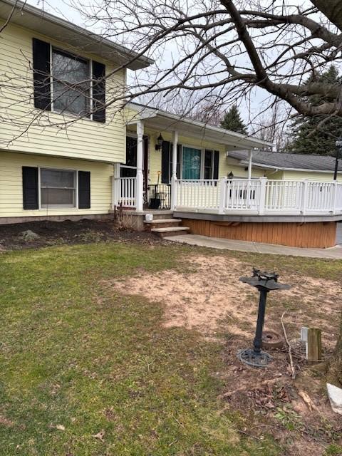 7429 Cherry Street Rd, Sennett, NY 13021 - split level home with covered porch and a front lawn