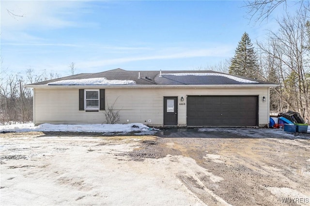 single story home featuring a garage