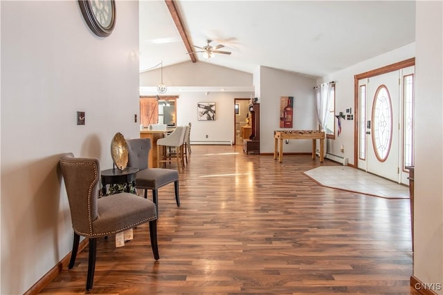 foyer entrance featuring a baseboard heating unit, a baseboard radiator, wood finished floors, and vaulted ceiling with beams