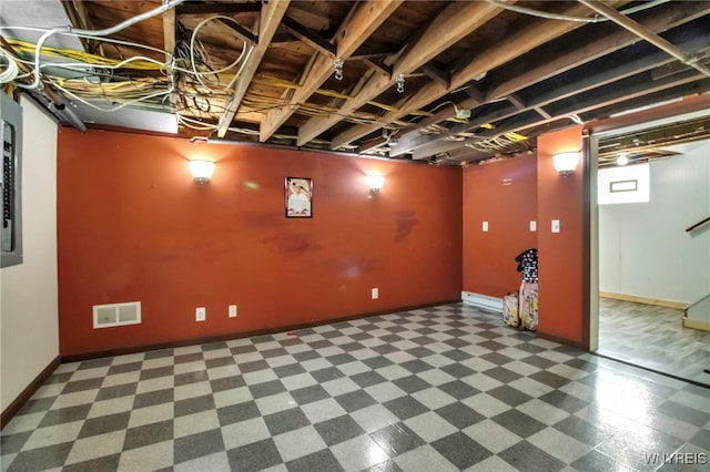 finished basement featuring stairway, baseboards, and visible vents