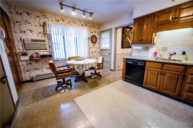 kitchen with a wall unit AC, wallpapered walls, black dishwasher, and a sink