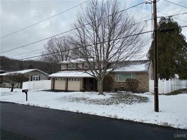 view of front of property featuring fence