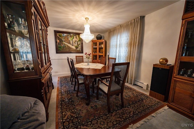 dining area featuring a baseboard radiator and a notable chandelier