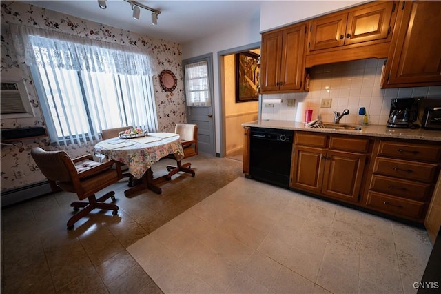 kitchen with a sink, baseboard heating, decorative backsplash, dishwasher, and brown cabinetry