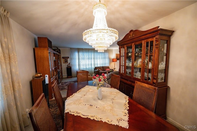 dining area featuring a notable chandelier