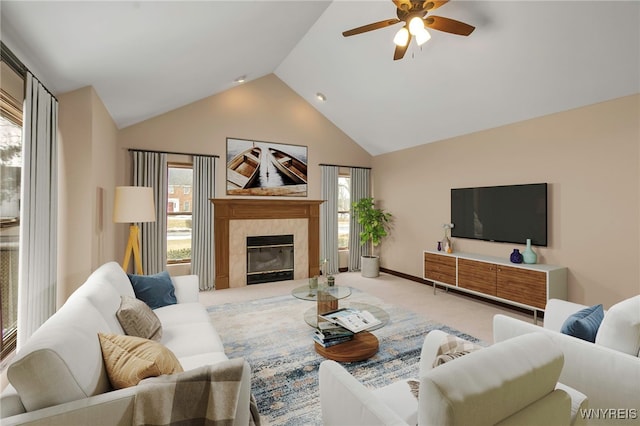 living room with carpet, a fireplace, high vaulted ceiling, and a ceiling fan