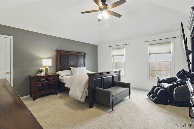 bedroom featuring lofted ceiling, light carpet, a ceiling fan, and baseboards