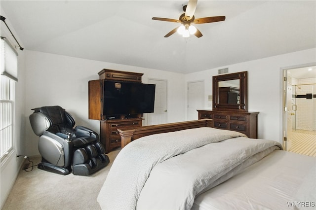 carpeted bedroom with lofted ceiling, multiple windows, visible vents, and a ceiling fan