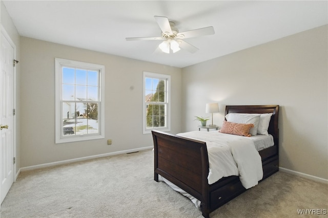 bedroom with visible vents, carpet, a ceiling fan, and baseboards