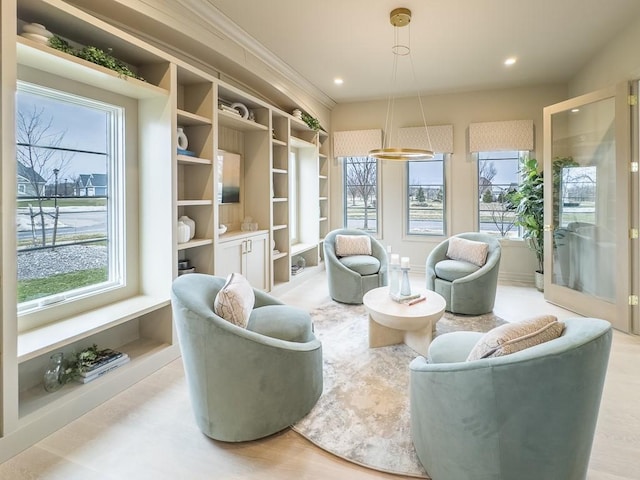 living area with light wood-type flooring, a wealth of natural light, and recessed lighting