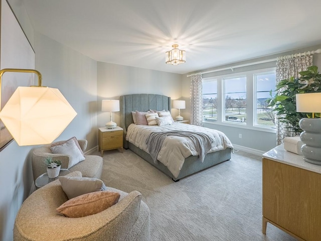 carpeted bedroom with baseboards