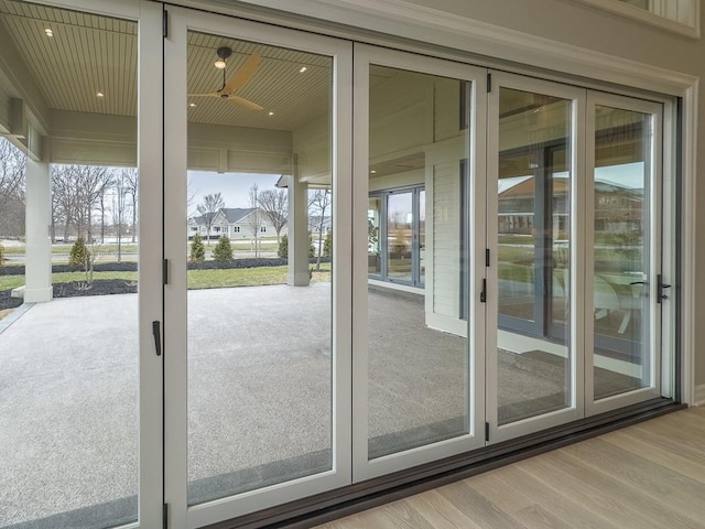 doorway with french doors and wood finished floors