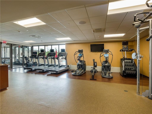 workout area with a paneled ceiling and visible vents