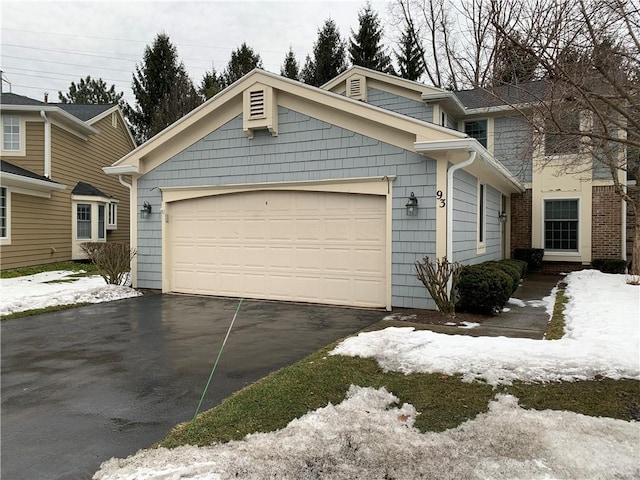 view of front of property with a garage and driveway