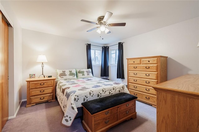 bedroom featuring ceiling fan, carpet floors, a closet, and baseboards