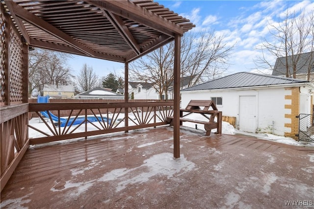 deck with a pool and a pergola