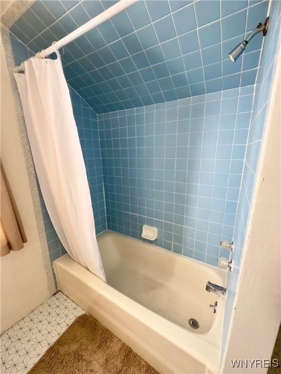 full bathroom with shower / bathtub combination with curtain and tile patterned floors