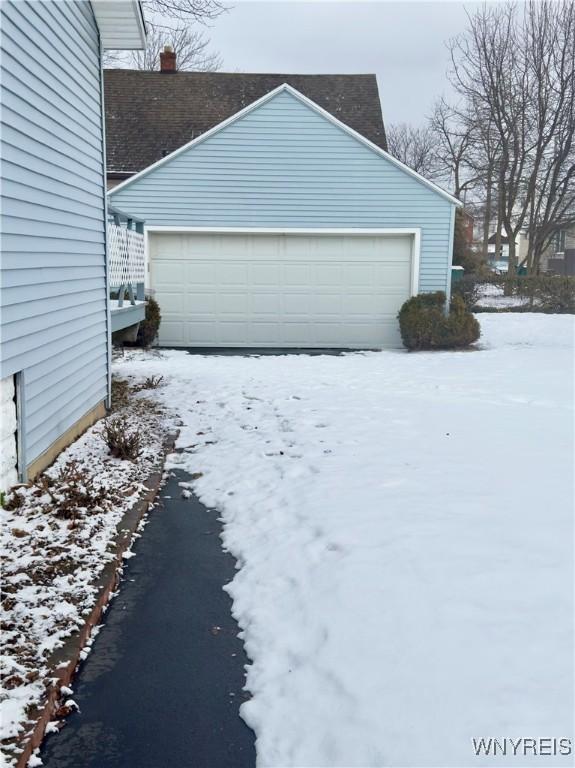 view of snow covered garage