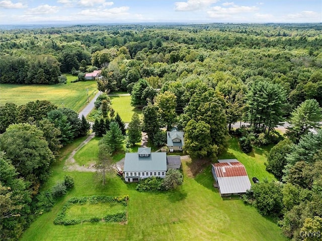 drone / aerial view featuring a view of trees