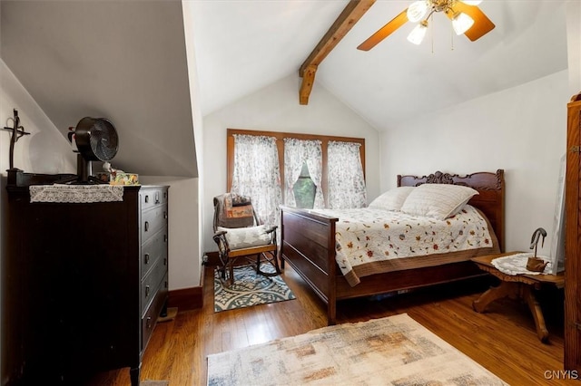 bedroom with a ceiling fan, lofted ceiling with beams, and wood finished floors