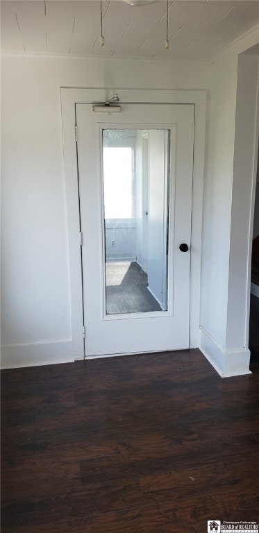 doorway to outside featuring dark wood-style floors and baseboards