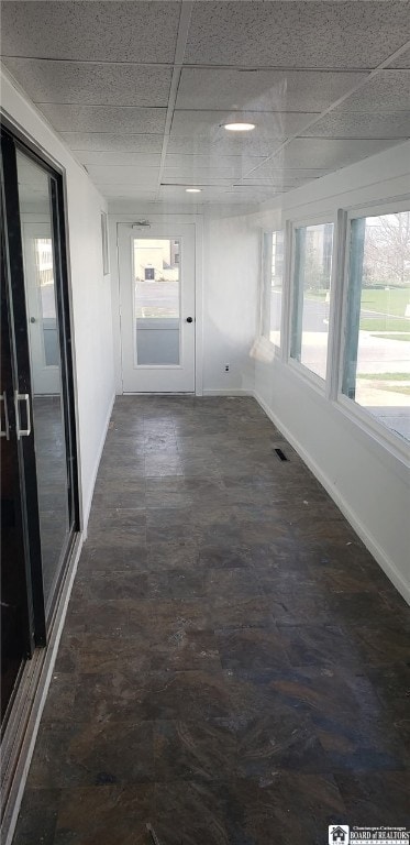 interior space featuring a drop ceiling and visible vents