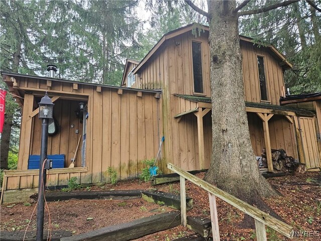 view of home's exterior featuring a gambrel roof