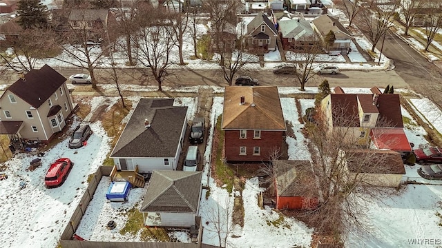 snowy aerial view featuring a residential view