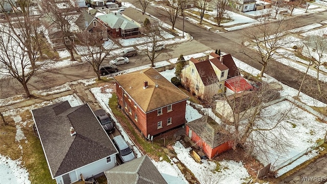 snowy aerial view with a residential view