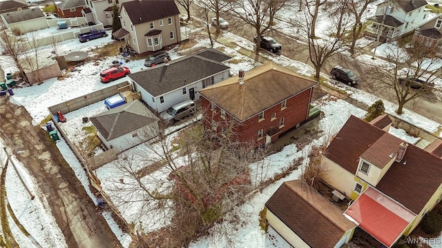 snowy aerial view with a residential view