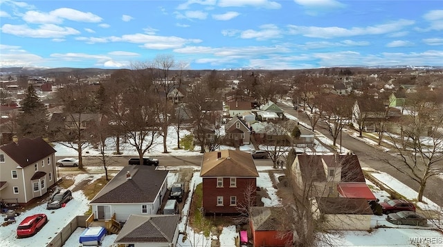 snowy aerial view with a residential view