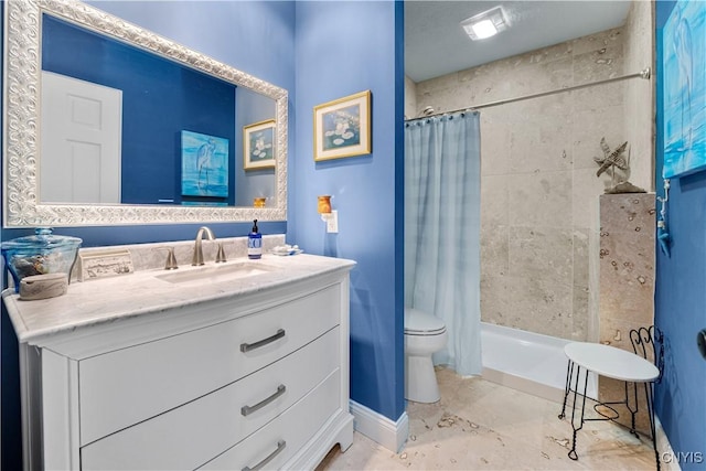 bathroom with curtained shower, vanity, and toilet