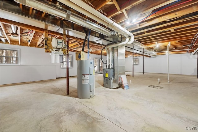 basement with water heater and heating unit