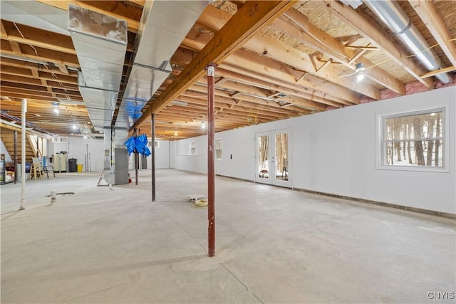 basement featuring french doors and plenty of natural light