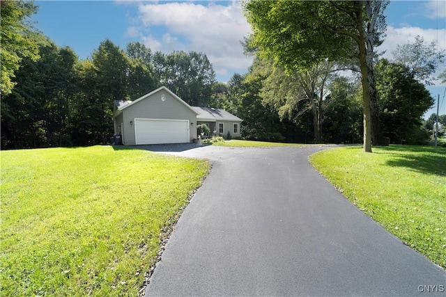 ranch-style house with aphalt driveway, a front lawn, and an attached garage