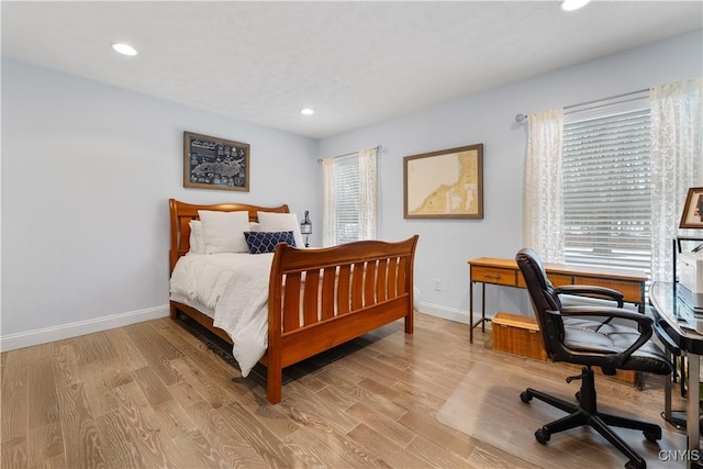 bedroom featuring recessed lighting, baseboards, and wood finished floors