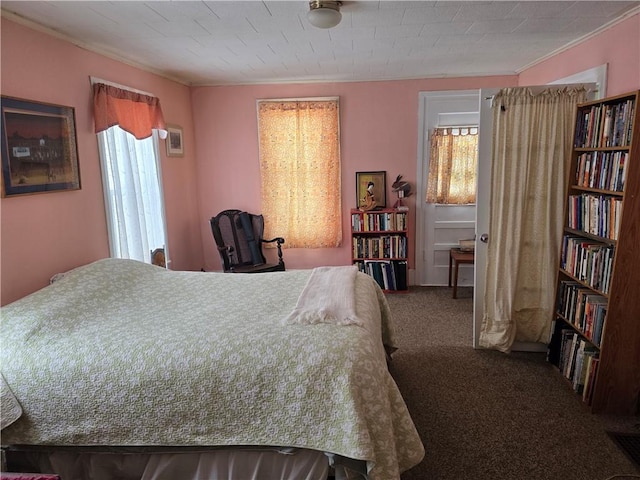 carpeted bedroom featuring crown molding