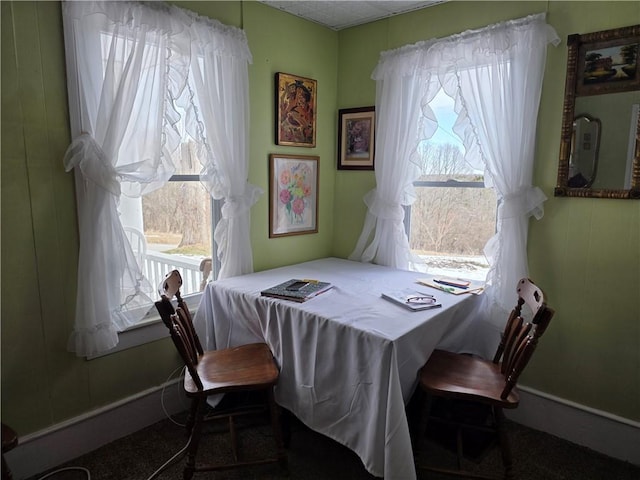 dining area featuring baseboards