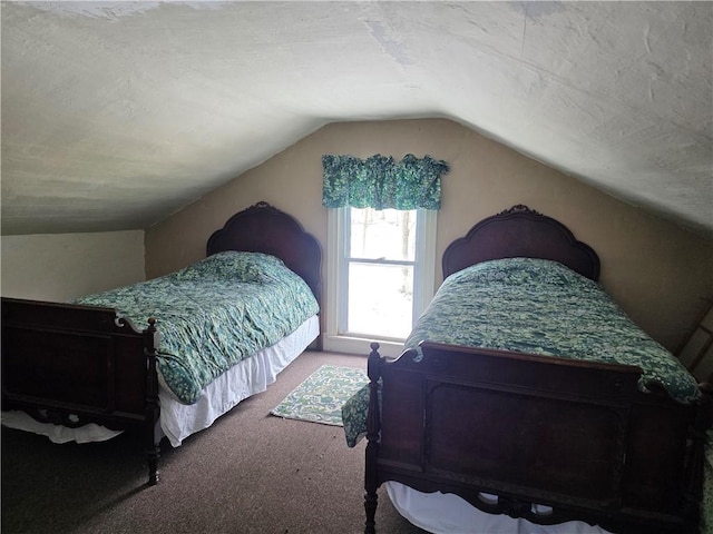 carpeted bedroom with lofted ceiling and a textured ceiling