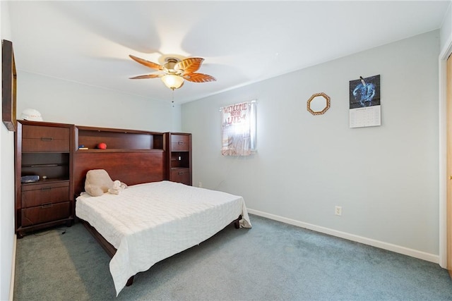 carpeted bedroom featuring baseboards and a ceiling fan