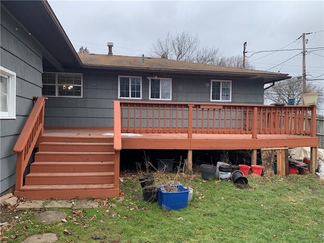 wooden deck featuring a yard