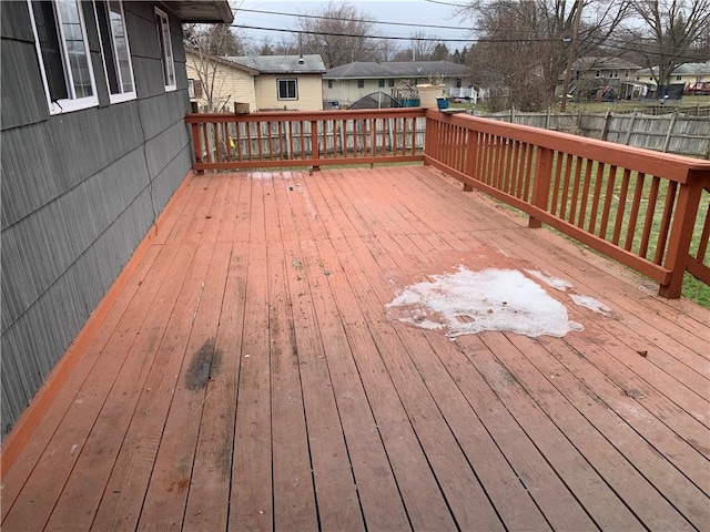 wooden deck with fence and a residential view