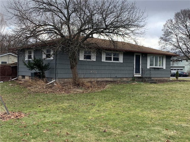 ranch-style home with a front lawn